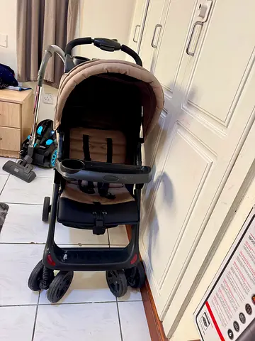 Lightweight Beige Baby Stroller - Good Condition