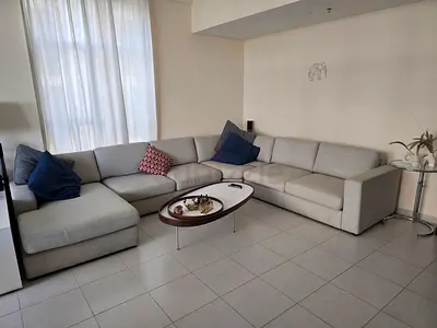Light grey L-shaped fabric sofa, good condition