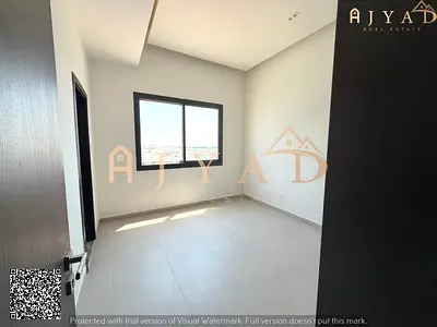 For annual rent: 2 bed hall apartment in Al Alia Ajman, close to Sh. Mohd. Bin Zayed Rd, 2 master bedrooms, semi-separated hall, large kitchen, 3 bath