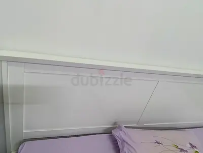 White wooden bed headboard - clean modern panel design with medicated mattress