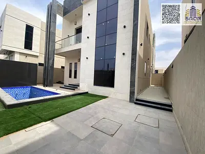 Luxury villa for sale with a swimming pool and spacious yard, price includes registration fees.