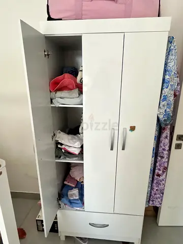 White multi-compartment wardrobe / storage cabinet with drop-down door