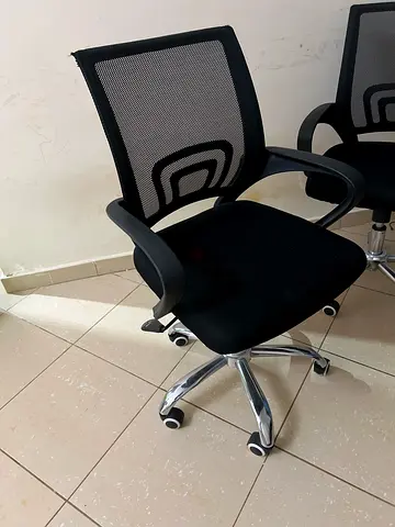 Black Mesh Office Chairs with Armrests and Wheels —