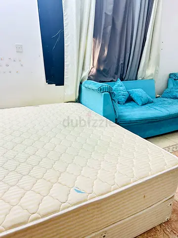 Queen mattress with teal sofa — very good condition few times used very comfortable bed