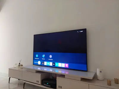 65-inch Samsung Smart QLED TV (used) - sleek flat panel with smart features