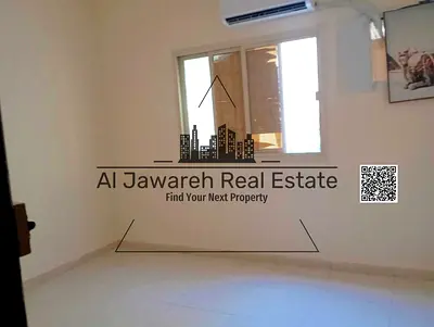 Studio apartment with separate kitchen, bathroom, and split AC unit in Al Nuaimiya 2, Ajman.