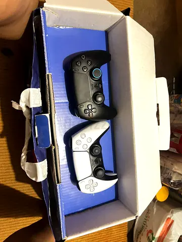 Pair of PS5 DualSense Controllers — White and Black (Used)