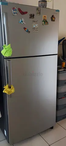 Silver double-door refrigerator, good working condition