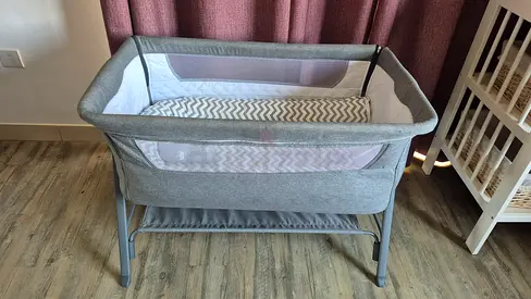 Grey bedside bassinet / baby cradle in good condition
