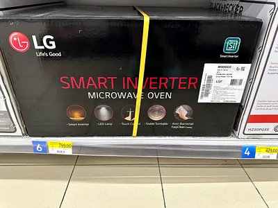 LG Smart Inverter Microwave Oven (boxed) - 799 AED shelf price shown