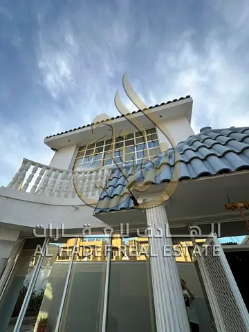 Furnished villa in Al Falaj, 3 bedrooms and 2 halls, balcony & outdoor seating, equipped kitchen, parking for 3 cars, split AC.