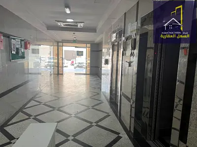 Building for sale in Muwailih area, directly on a main street.