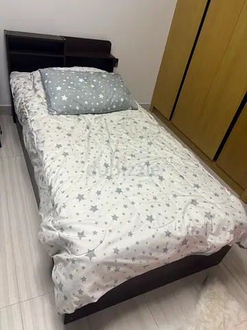 Single bed frame with mattress and star-pattern bedding - good condition