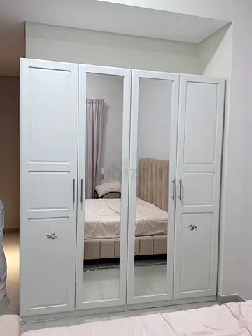 White 4-Door Wardrobe with Mirrored Center Panels - Good Condition