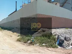 A fenced-in area with prefabricated sheds, 70 kV electricity, 3 workers' accommodation rooms wit