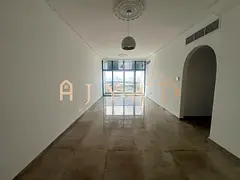 2BR hall for annual rent in Mushrif, Ajman: new tower, private parking, central AC, balcony, hotel-s