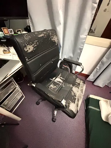 Used black office chair with worn faux leather - needs reupholstery