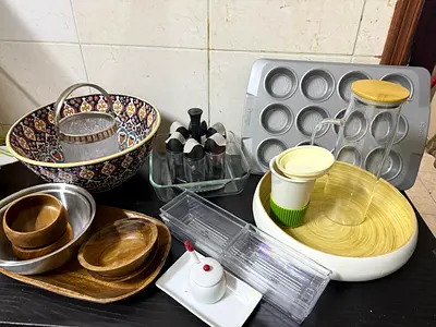 Mixed kitchenware set — bowls, trays, muffin pan, jars and organizers