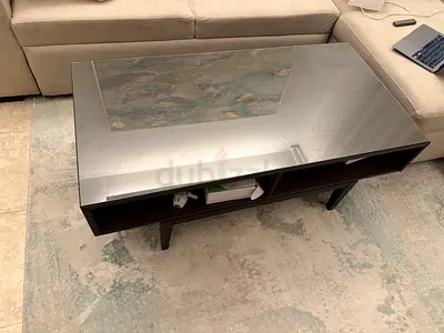 Modern rectangular coffee table with glass top and storage