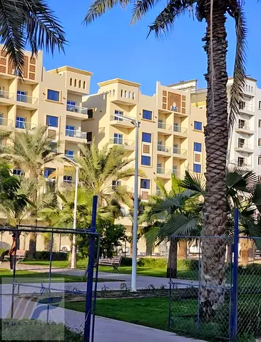 Own a studio apartment for just AED 2,900 per month | Closed kitchen and balcony with garden view