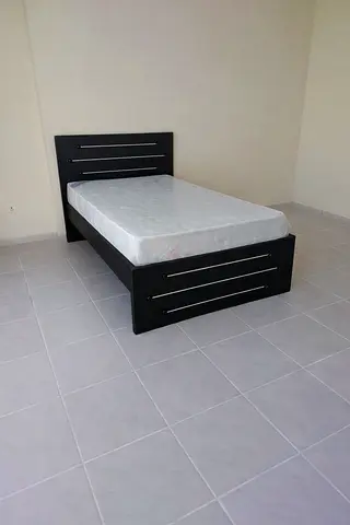Double black wooden bed frame with mattress - good condition