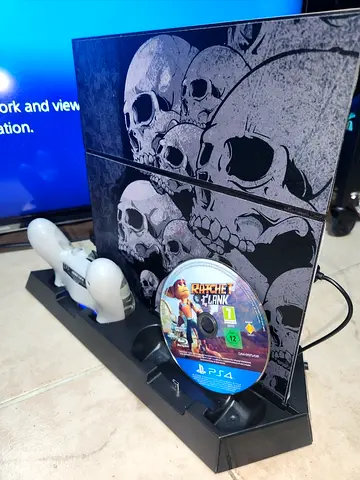 Playstation 4 (1 TB) with controller,  cooling pad, charger and game.