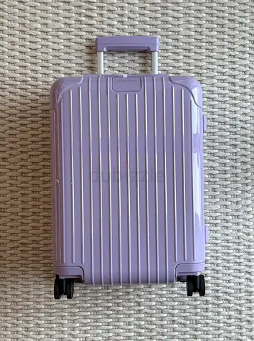 Rimowa cabin suitcase in purple