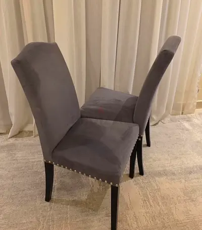 4 Grey Upholstered Dining Chairs with Stud Detail from The One  selling all 4 for 250AED