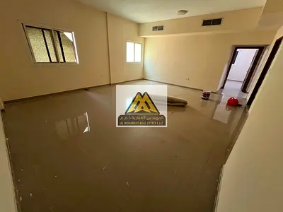 A spacious 4-bedroom apartment with a living room and a private rooftop for annual rent in Al Nuaim