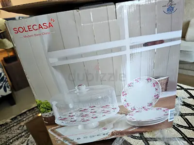 Cake stand with cover and spoon with 5 plates and a three layer stand