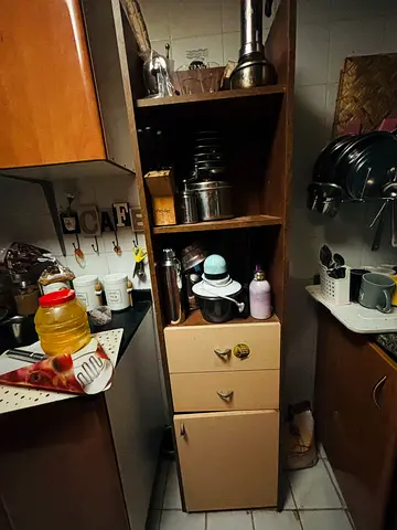 Tall narrow kitchen cabinet with shelves and drawers - good for pantry or utensils. Solid wood