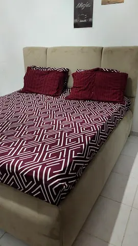 New king sized  bed with spring .mattress used few times selling bcoz moving out