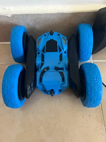 Blue remote-control stunt car with big wheels - works fine