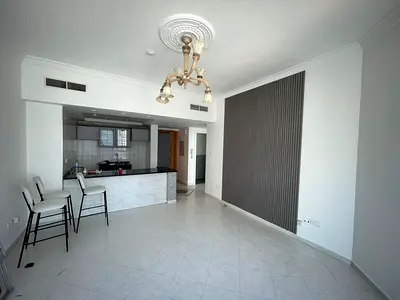Luxury 1BR apartment with laundry room, wardrobes, free gym & pool, landlord-paid AC, prime location near Dubai exit.
