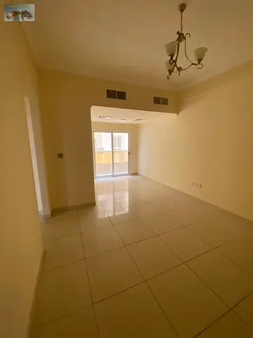 2-bedroom apartment and living room for rent in a prime location next to Al Hikma School, with central air conditioning, 2 bathrooms, built-in wardrob