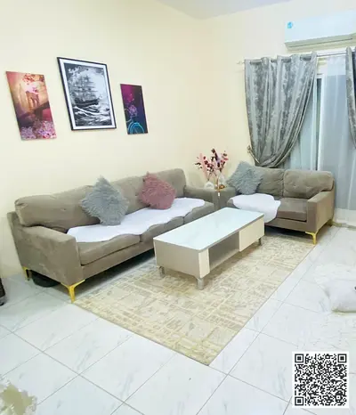 Luxury one-bedroom apartment with a living room and balcony offering an open view. Ajman, Al Rawda