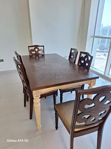 Solid Wood 6-Seater Dining Table with Carved Chairs - Good Condition