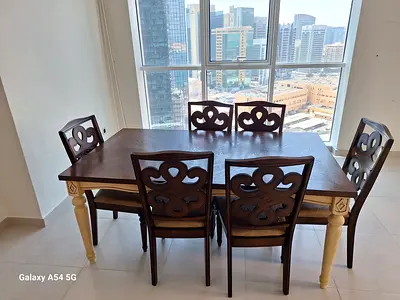 Solid Wood 6-Seater Dining Table with Carved Chairs - Good Condition