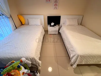 Two single beds with mattress and bedside table - good condition