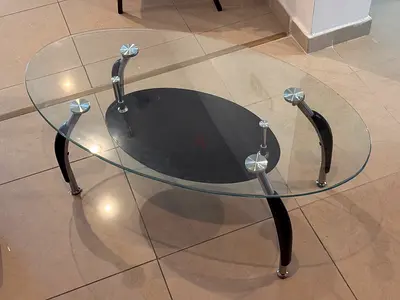 Oval Glass Coffee Table with Black Base and Curved Legs