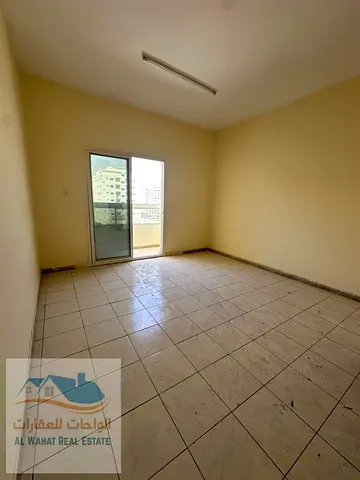 For annual rent: One bedroom, living room, bathroom, and balcony in Al Rashidiya 3, near the Cornic