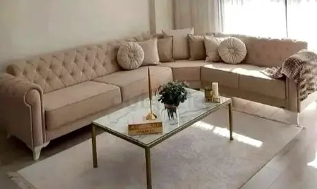 Beige L-shaped Chesterfield Sofa with Cushions -