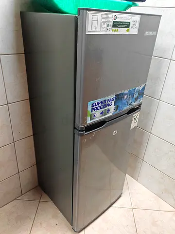 Small double-door refrigerator in good working condition