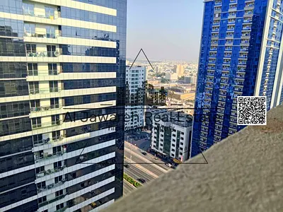 Two-bedroom apartment for rent with wardrobes, parking, and free air conditioning in Al Rashidiya 3