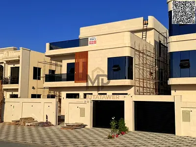 A villa with all-inclusive price (electricity, water, and air conditioning) on ​​the main street, ready to move in, in one of Ajman's most prestigious