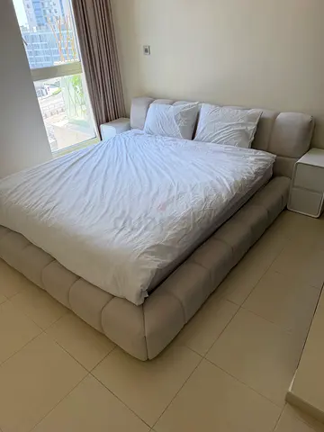 Beige Upholstered King Bed with Padded Headboard