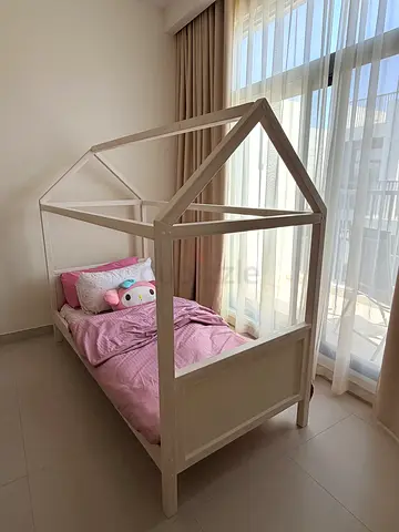 White wooden house-frame single childrens bed (no mattress). Need a fresh paint.