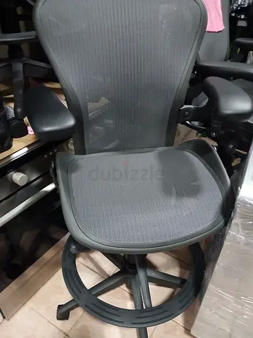 Herman miller brand mesh office chair with headrest and adjustable armrests