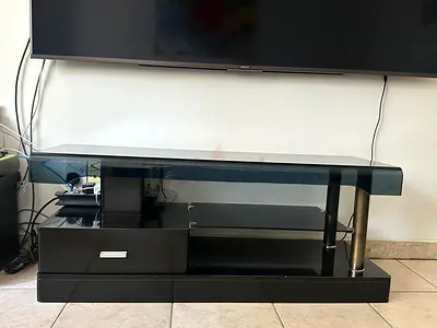 Black glass TV stand with drawer and shelves