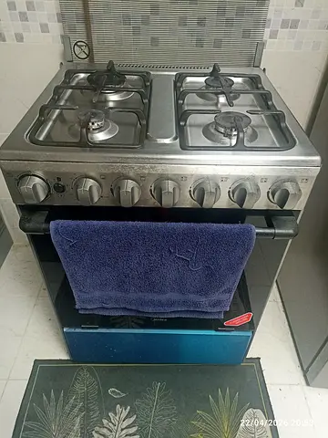 Used 4-Burner Stainless Steel Gas Cooker with Oven - Good Working Condition